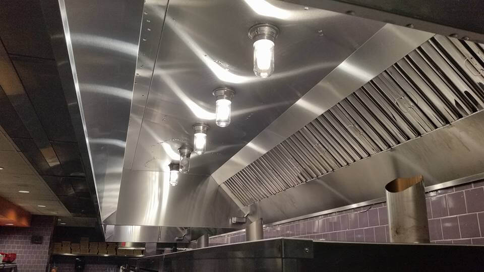 Clean commercial kitchen hood after documented service